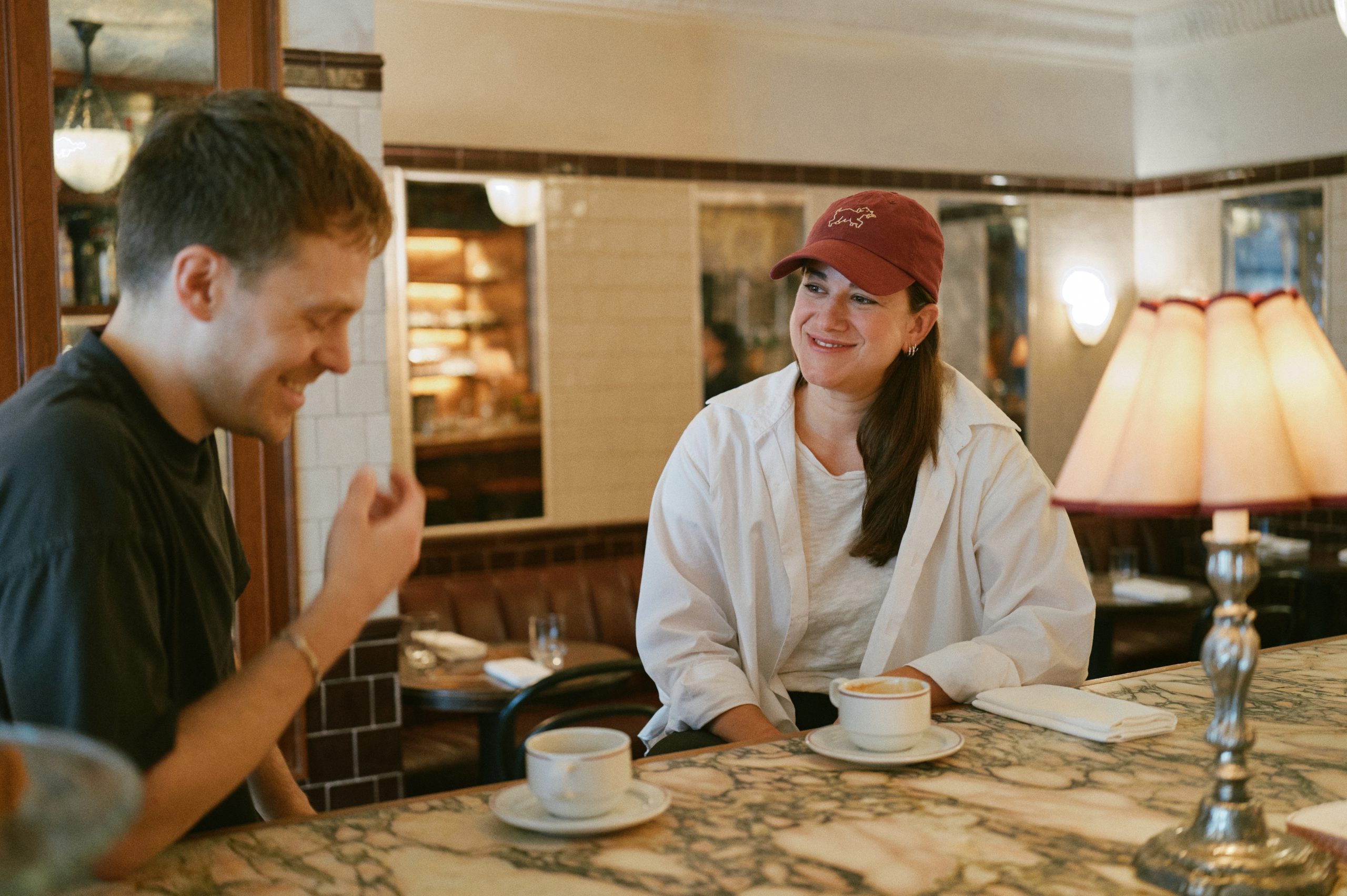 Two people chatting over coffee